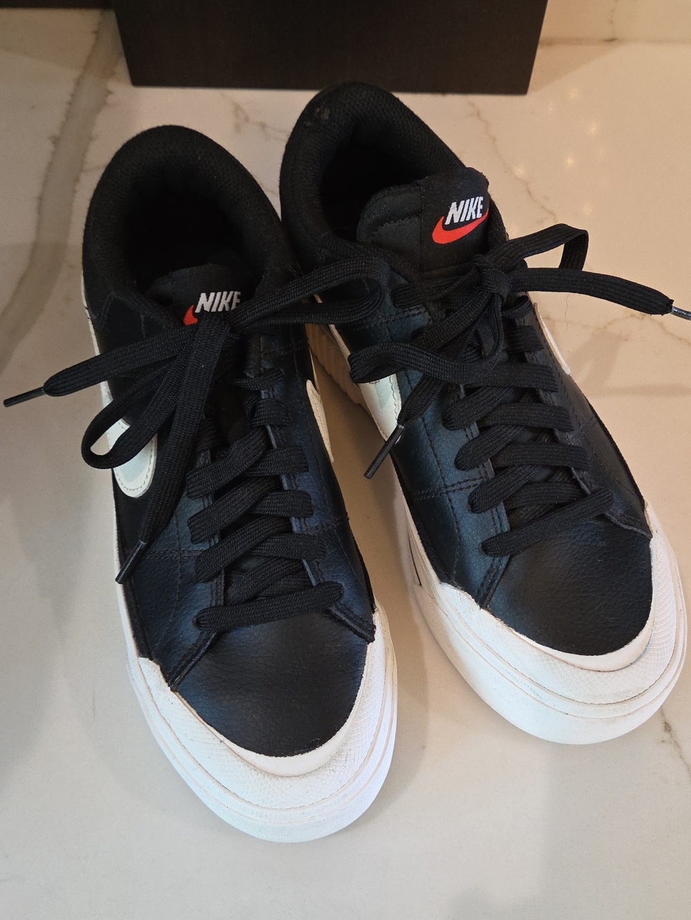 Nike Black and White Low-Top Sneakers with Red Swoosh